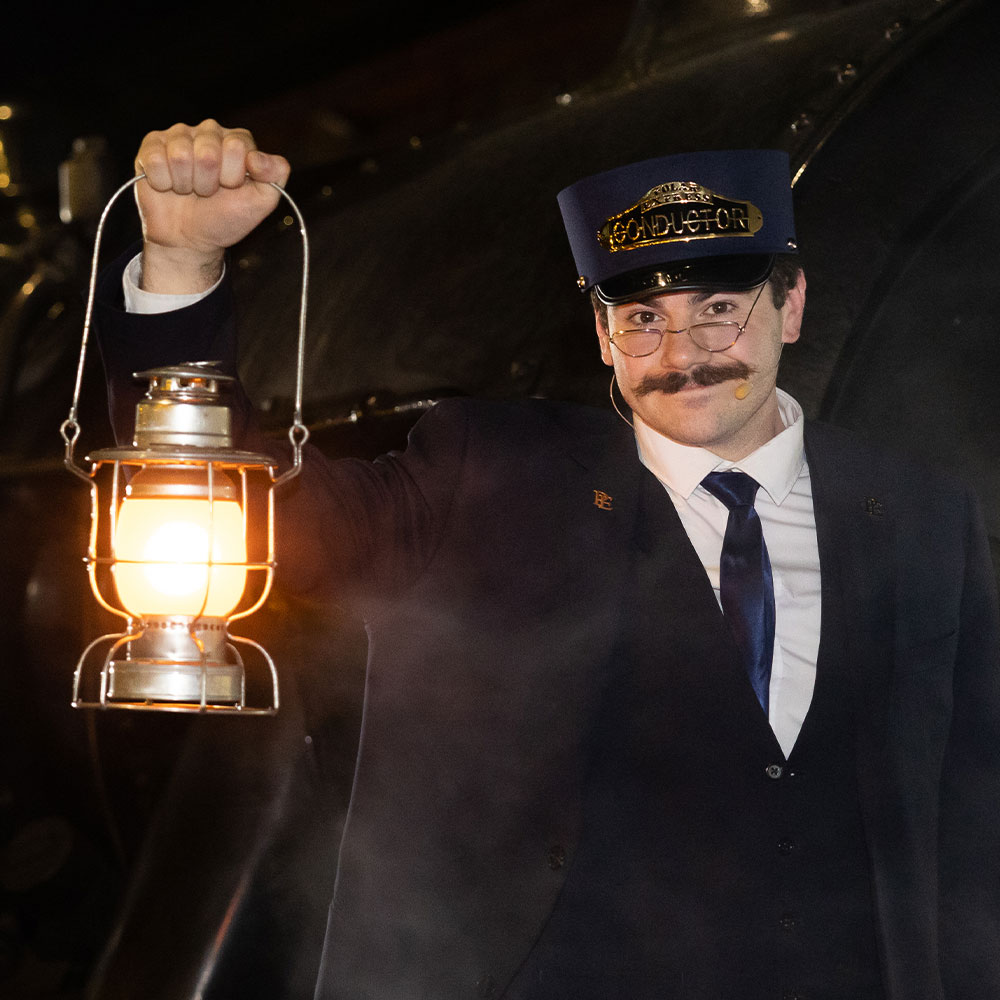 conductor with lantern at the polar express train ride