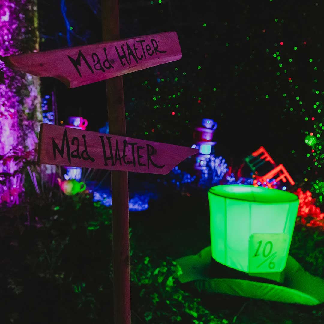 mad hatters hat and direction sign props at wonderglow light trail